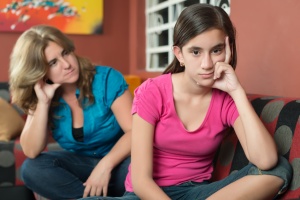 Teenage problems - Teenage girl with her sad and worried mother